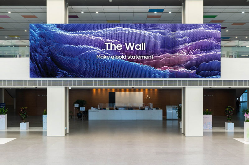 Samsung The Wall MicroLED video wall displaying abstract blue and purple imagery in a corporate lobby